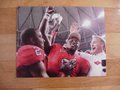 Picture: Mark Richt and D.J. Shockley of the Georgia Bulldogs celebrate the 2005 SEC Championship 16 X 20 poster.