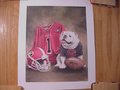 Picture: Georgia Bulldogs original art print with uniform, UGA in black, and helmet is 10 X 12 with an image area of 8 X 10. A great print for autographs!